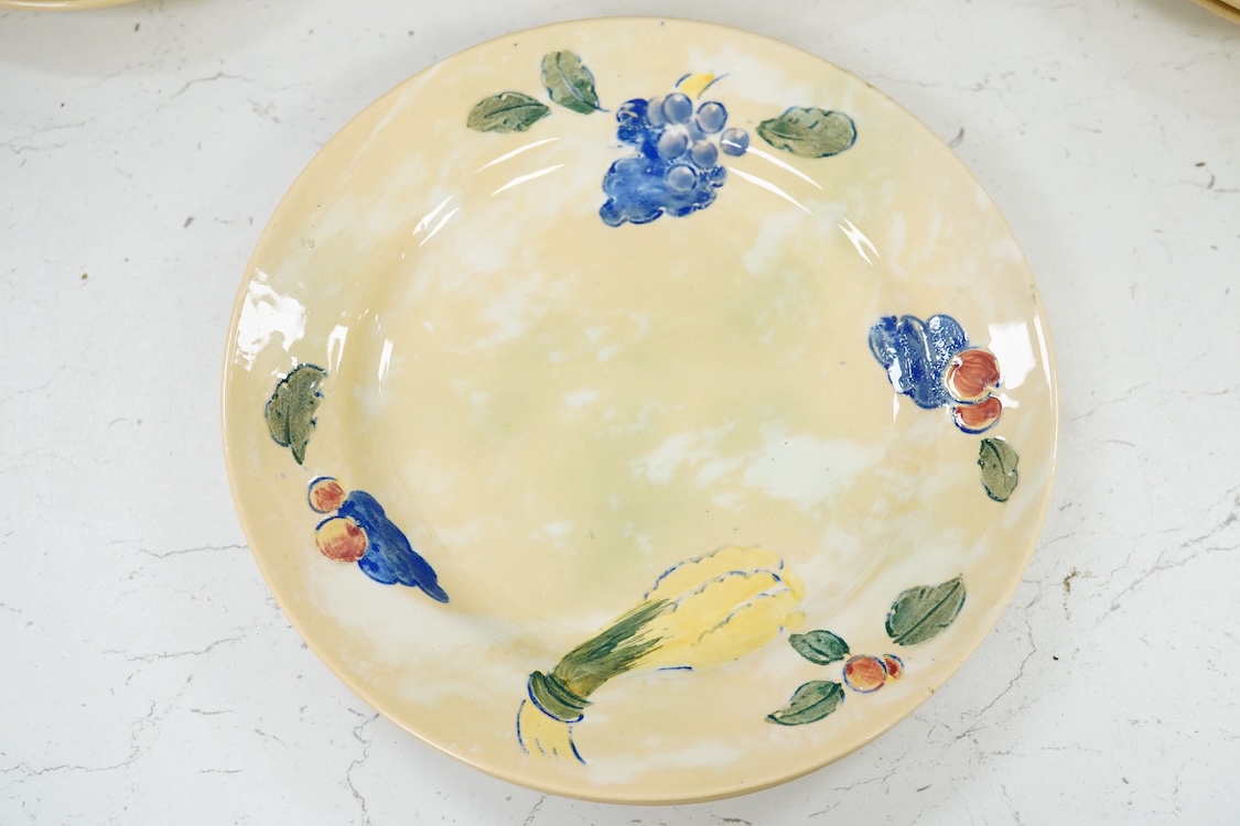 A collection of Doulton Brangwynware to include cups and saucers and a milk jug, largest 19cm in diameter